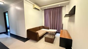 Deluxe Apartment, Balcony | Living area