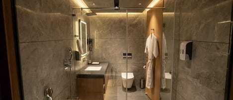 Separate tub and shower, free toiletries, hair dryer, slippers