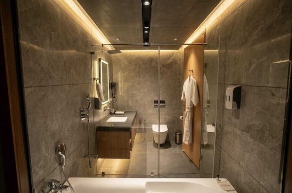 Separate tub and shower, free toiletries, hair dryer, slippers