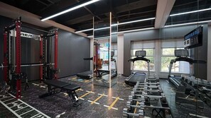 A gym with weightlifting equipment, treadmills, and a bench. - Y.TUO HOTEL - Xi'an Bell Tower (Xi'an)