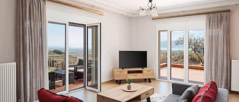 Deluxe Apartment, Balcony, Sea View | Living area