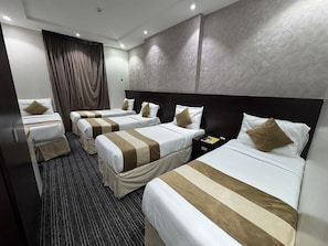 Family Quadruple Room, Balcony, City View | In-room safe, blackout drapes, iron/ironing board, free WiFi - 2 Asfar alhiaz hotel (Makkah)
