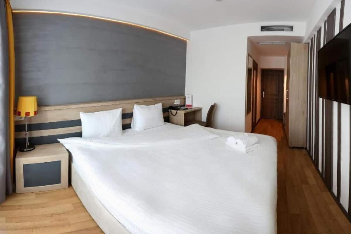 Standard Double Room, City View | In-room safe, blackout drapes, soundproofing, iron/ironing board