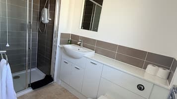 Shower, towels, soap, toilet paper