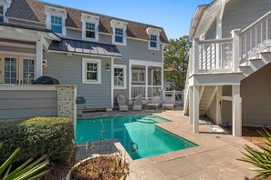 A two-story house with a swimming pool, a covered patio, and a garage. - WaterSound Retreat | Private Pool | Near 30A Beach (Watersound)