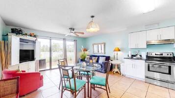Signature Condo, 1 Bedroom, Patio, Garden View | Living room | 50-inch Smart TV with digital channels