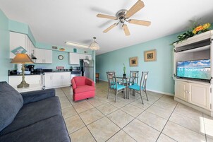 Signature Condo, 1 Bedroom, Patio, Garden View | Living room | 50-inch Smart TV with digital channels