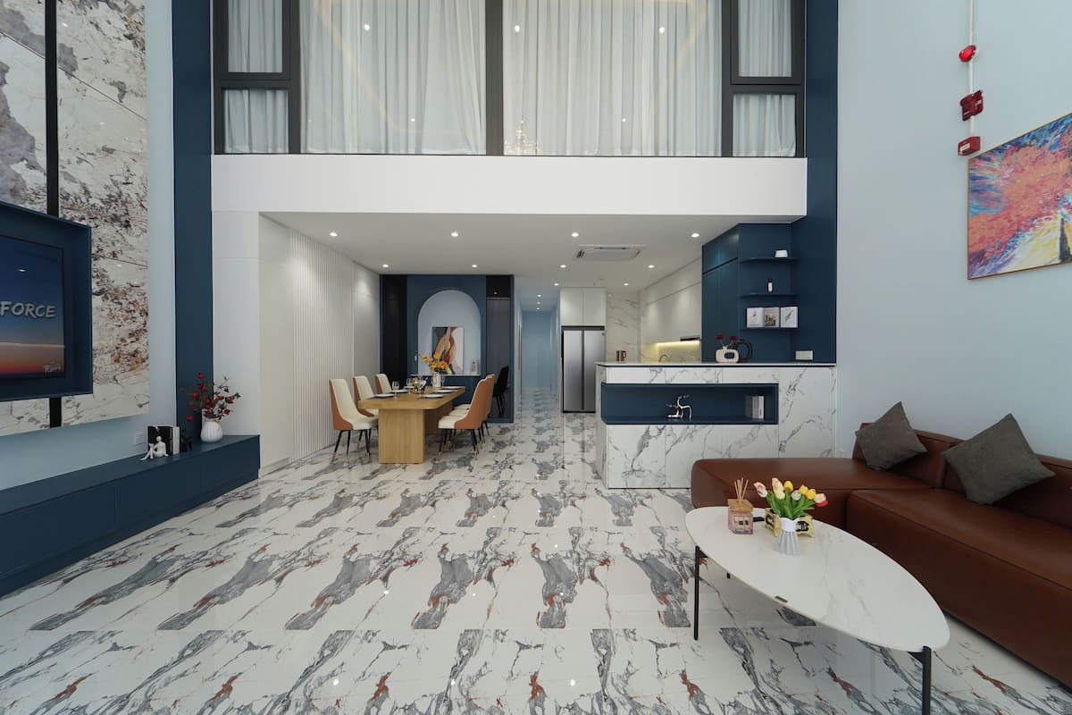 A modern interior with a dining area, kitchen, and living space.