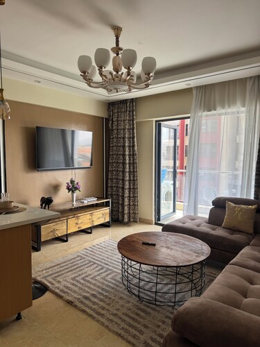 Quaint 1-bedroom condo close to the AirPort & SGR with fitness room in Nairobi
