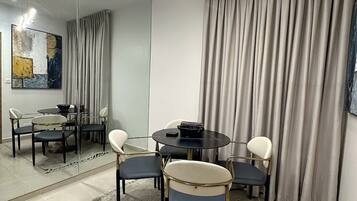 Deluxe Apartment, Balcony, City View | Dining