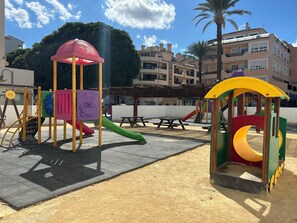 A playground with slides and climbing structures.