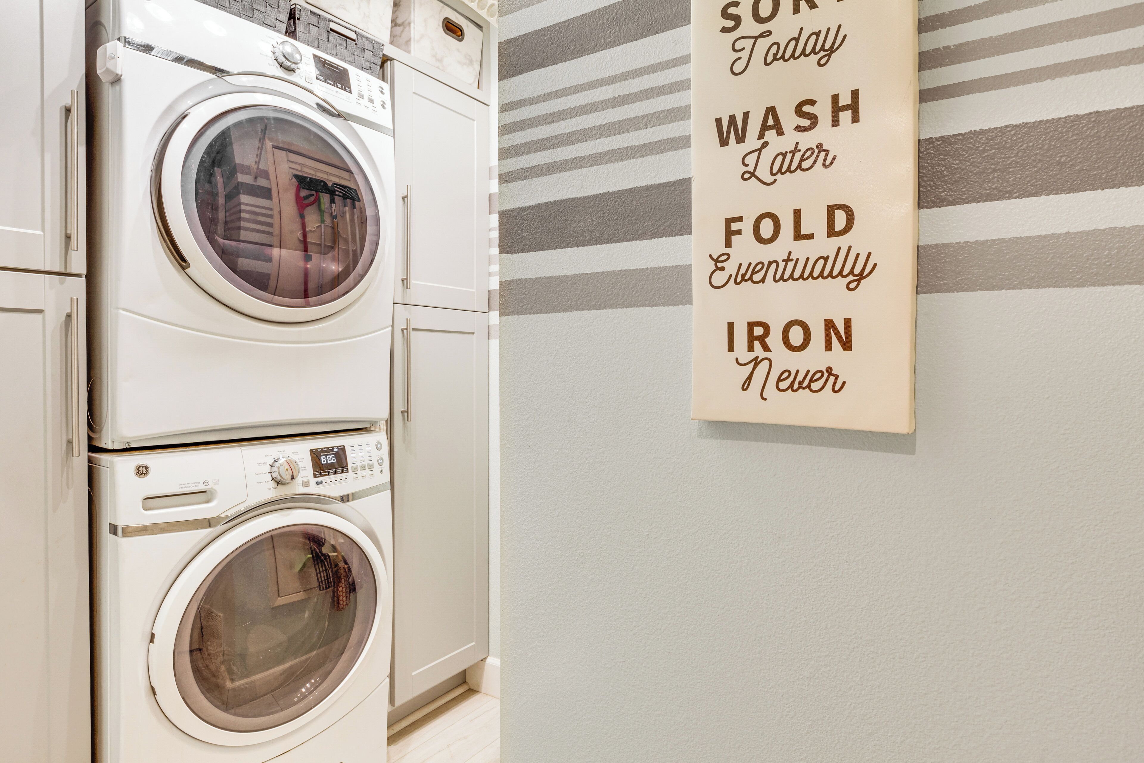 A wall-mounted sign with a laundry instruction.