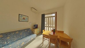 Apartment, 2 Bedrooms, Balcony, City View | Dining room - Coastal Home Between the Beach and the Center (Lignano Sabbiadoro)