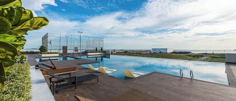 Outdoor pool, open 8:00 AM to 10:00 PM, pool loungers