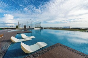 Outdoor pool, open 8:00 AM to 10:00 PM, pool loungers