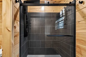 Shower, hair dryer, towels, shampoo