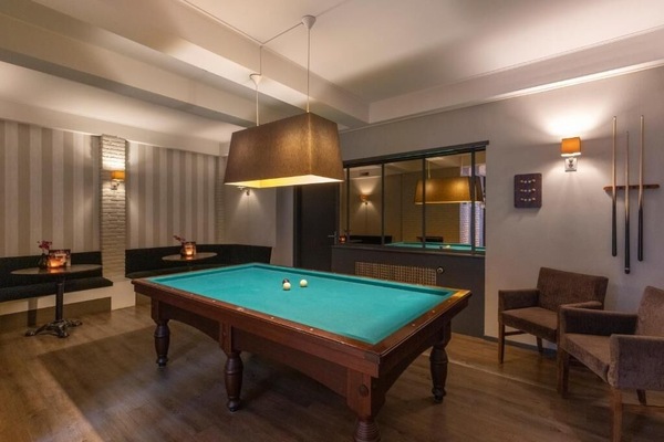 Challenge friends to an evening billiards match in cozy lounge.