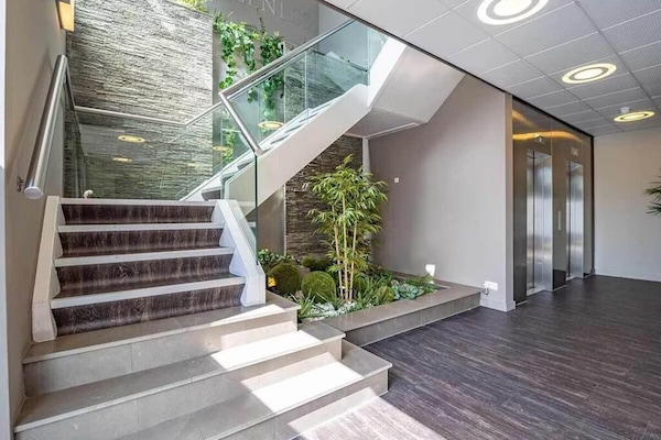 Arrive effortlessly through the airy lobby with modern design.