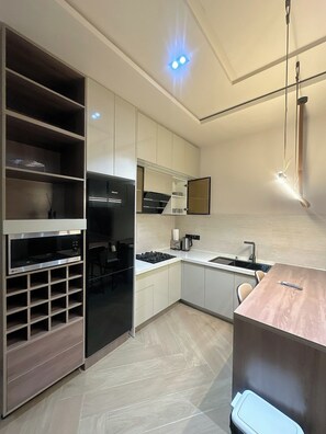 Apartament familiar, balcó, vistes a la ciutat | Cuina privada