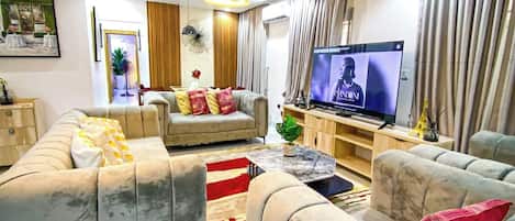 Family Apartment, Balcony, City View | Living area | Flat-screen TV