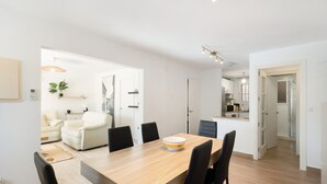 A modern kitchen with white cabinets, a microwave, and a sink. - Ground Floor Apartment with Private Pool (Sa Riera)