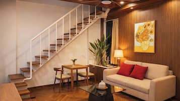 Family Quadruple Room, City View | Living area