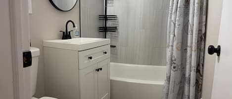 Shower, towels, soap, toilet paper