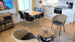 A modern kitchen with white cabinets, a microwave, and a coffee machine. - Villa Heimkehr Wohnung 10 by Interhome (Baabe)