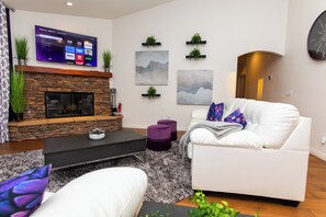 TV, fireplace - Group Getaway with Hot Tub, Fire Pit & 3 King Beds Near LEGOLAND (Vista)