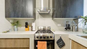 Coffee/tea maker, fridge, microwave, oven