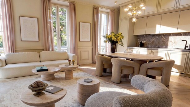 A spacious living area with a sofa, round coffee tables, a dining set, and a kitchen in the background. - Modern, A/C Apartment - 2bdr/4p - Cannes/beach (Cannes)