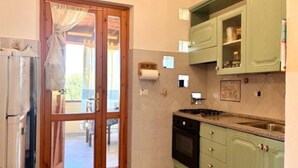 Fridge, cookware/dishes/utensils - Del sorriso e delle rondini by Interhome (Villasimius)