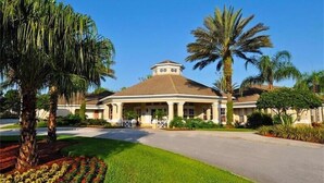 A large, single-story building with a central dome and a covered porch. - Windsor Palms Retreat: Pool, Resort Access & Minutes to Disney (Kissimmee)