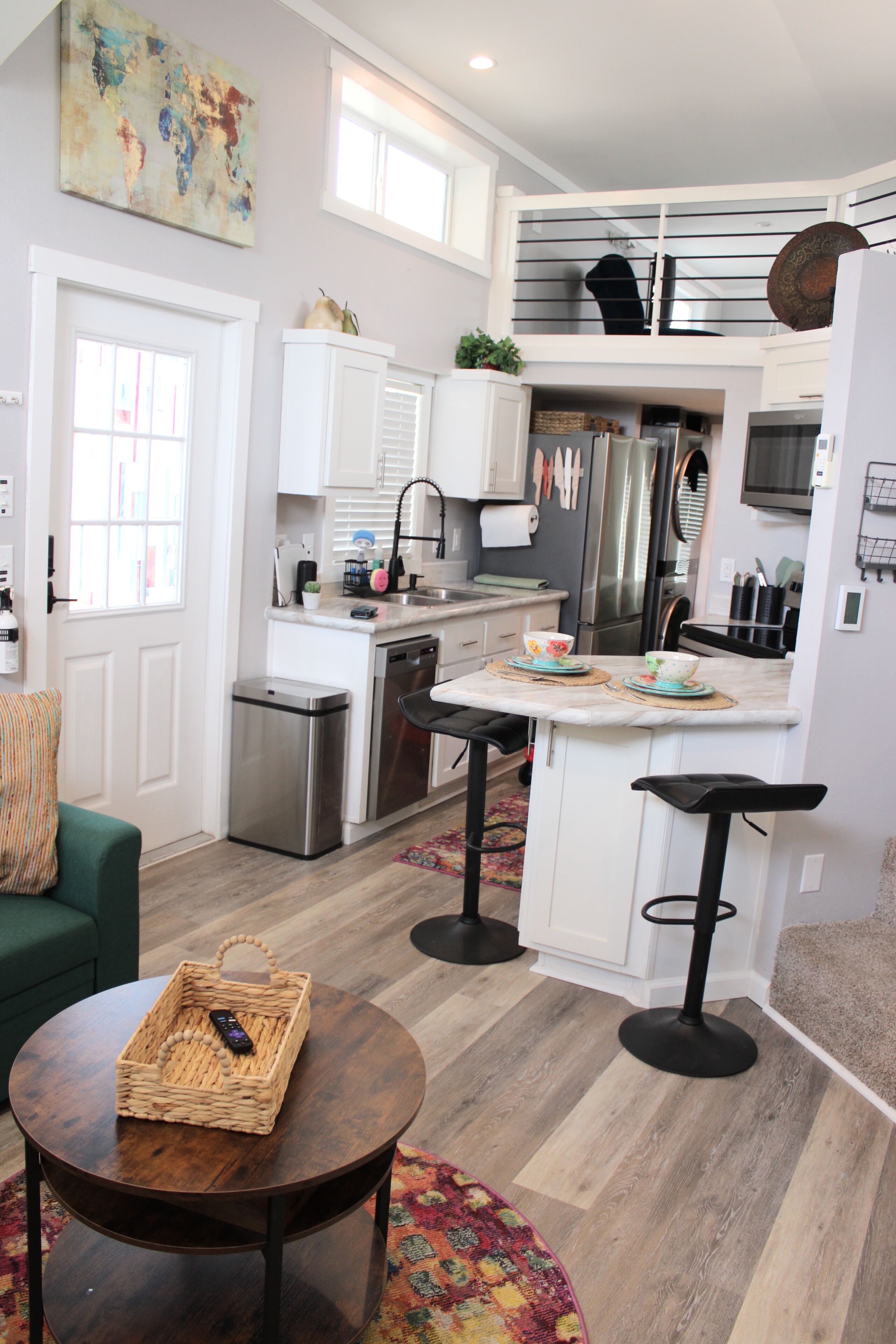 Bright loft-style kitchen with breakfast bar and modern stainless appliances