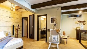 A room with a bed, a chair, a mirror, and a wooden ceiling. - Elegant Nian Villa Sea - Luxury Stay in Drosia, Chalkida (Chalkida)