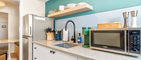 Fridge, microwave, stovetop, coffee/tea maker