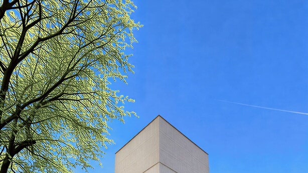 A modern building with a flat roof, multiple windows, and a black metal fence. - Apartment Near the Las Ventas F Bullring (Madrid)