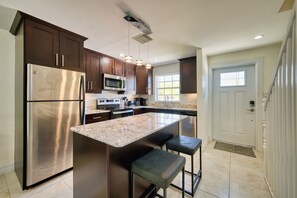 Private kitchen - Cozy 2-bedroom condo with sleeper in beautiful West Bay, steps from the beach (West Bay)