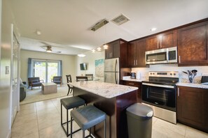 Private kitchen - Cozy 2-bedroom condo with sleeper in beautiful West Bay, steps from the beach (West Bay)