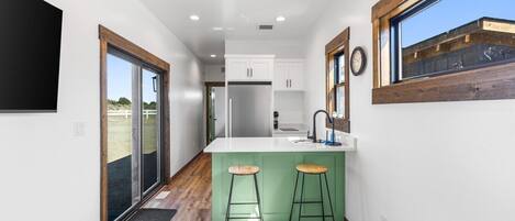 Fridge, microwave, stovetop, coffee/tea maker