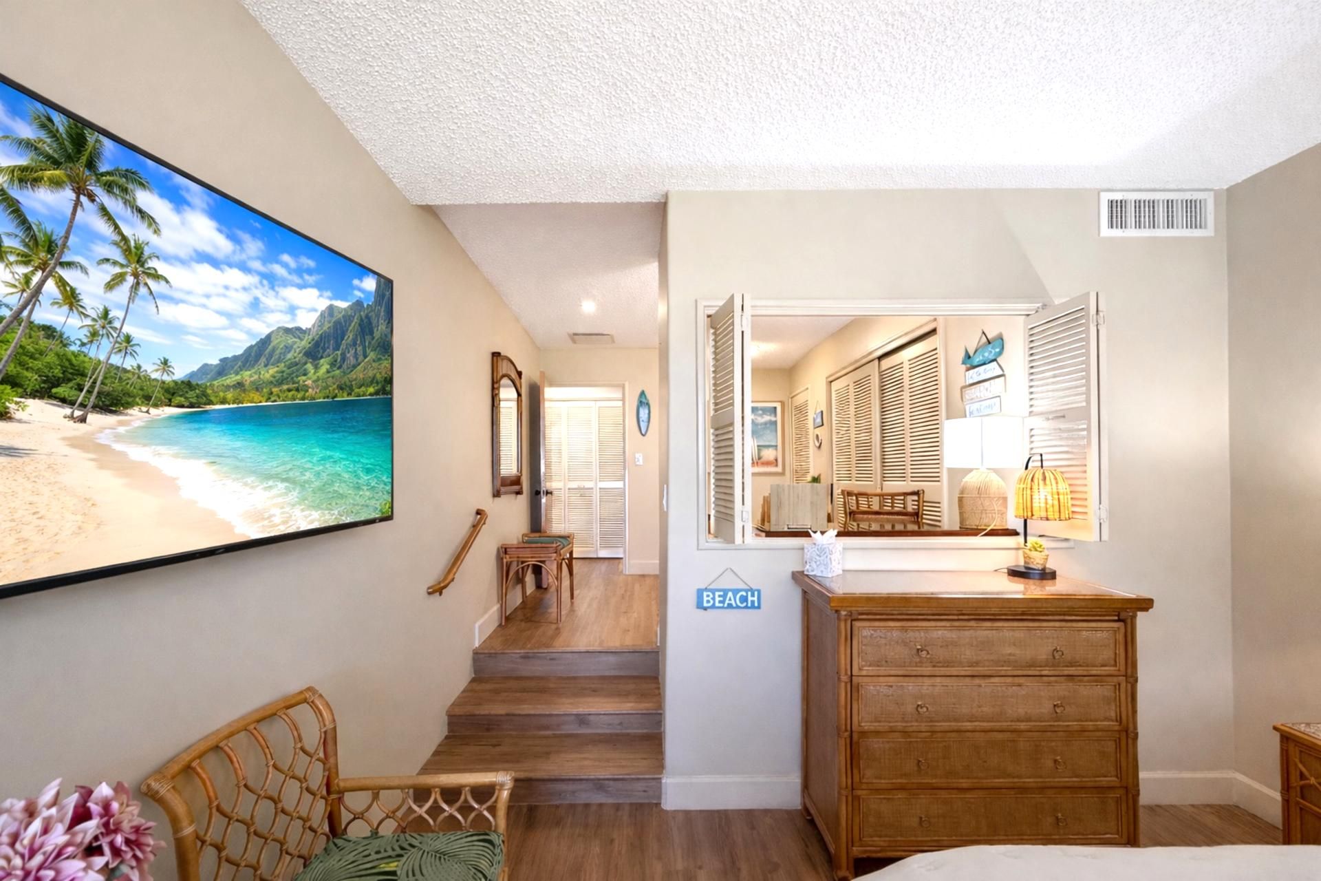 The primary suite features a private desk area, perfect for traveling professionals