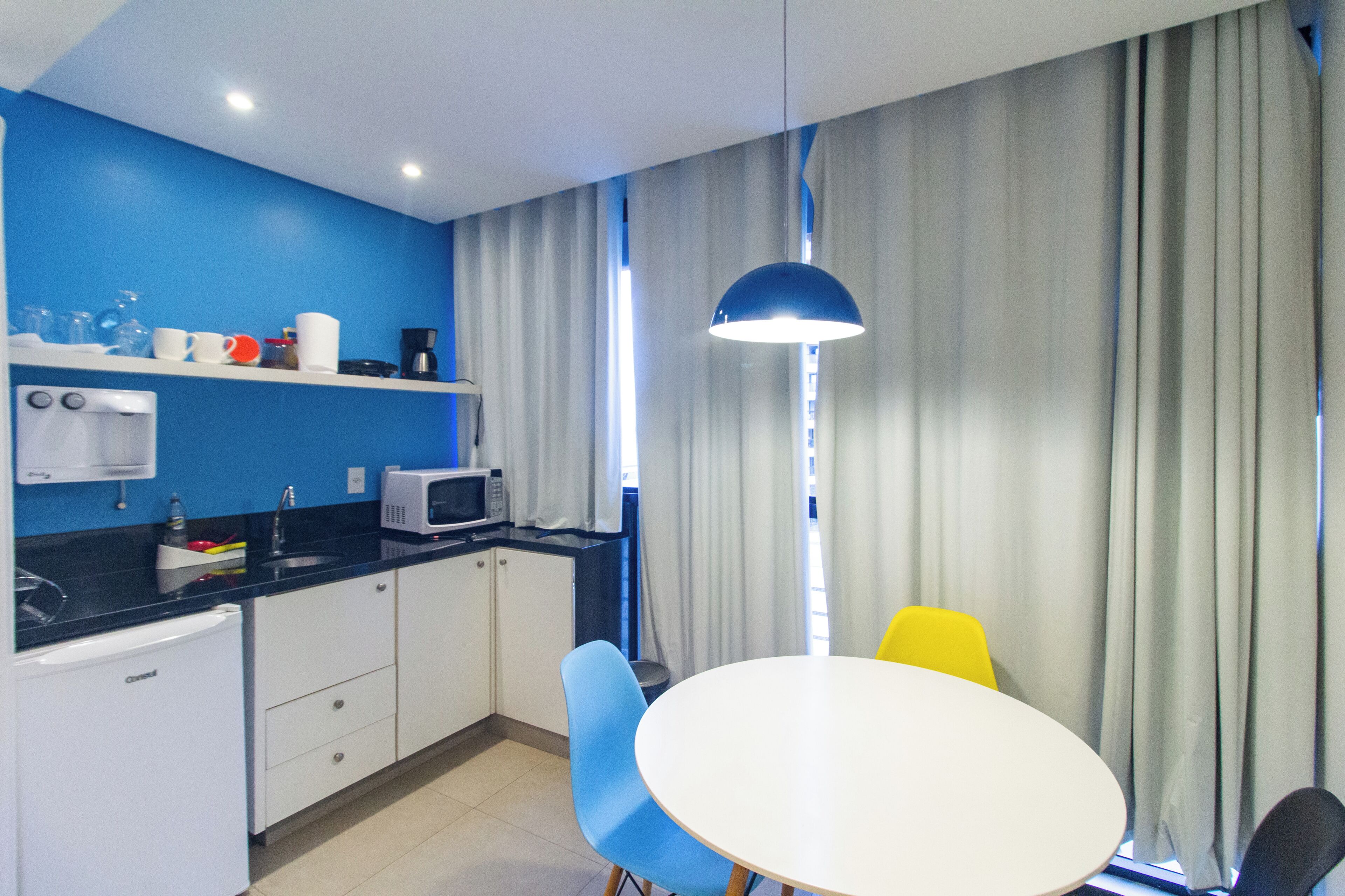 Superior Studio, Pool View | Private kitchen | Mini-fridge, microwave, cleaning supplies, paper towels
