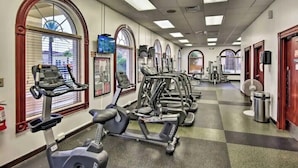 A gym with treadmills, elliptical machines, and stationary bikes. - 4Bd 3Ba, (2 Primary), 8.7m to Disney, No Resort Fees! (Davenport)