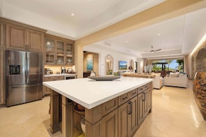 A spacious kitchen with a large island, built-in appliances, and a view to the living area. - Hacienda Beach Club Villa w/ Private Pool! (Hacienda Beach Club & Residences)