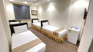 A hotel room with two single beds, a small refrigerator, a window with blinds, and a wall-mounted TV. - nazal alroh alhora -Hajj Street (Makkah)