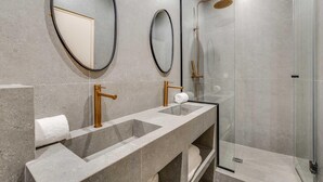A modern bathroom with a dual sink vanity, a walk-in shower, and two wall-mounted mirrors. - Spacious Apartment - 2br/10p - Place D'italie (Paris)