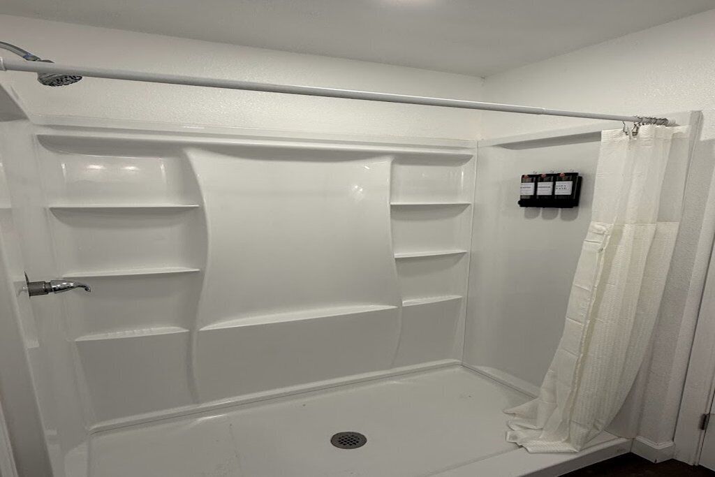 Shower, towels, soap, toilet paper