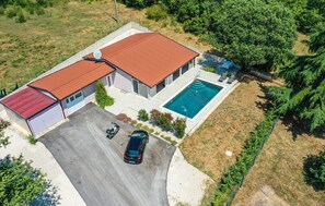 A residential property with a swimming pool, a garage, and a covered carport. - Gorgeous home in Nova Vas (Nova Vas)