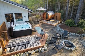 A hot tub, deck, outdoor seating, and a fire pit area. - 5-acres, 2 Cabins, Hot Tub, Sauna, Game Rm, Trails (Grapeview)