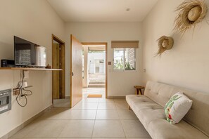 Loft conforto, vista para o jardim | Área de estar